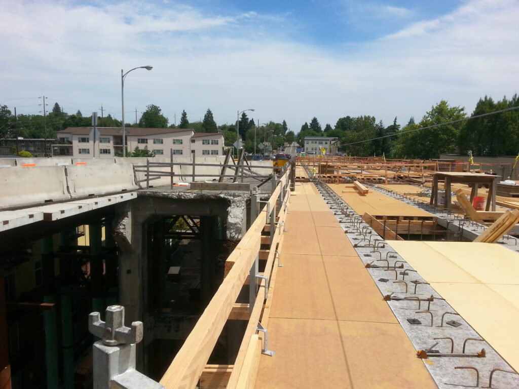 View looking west from the tip of the east side construction.  You can see the old bridge and new bridge just inches apart.  This small part of the old bridge will be one of the last remaining parts to be addressed, as described below.