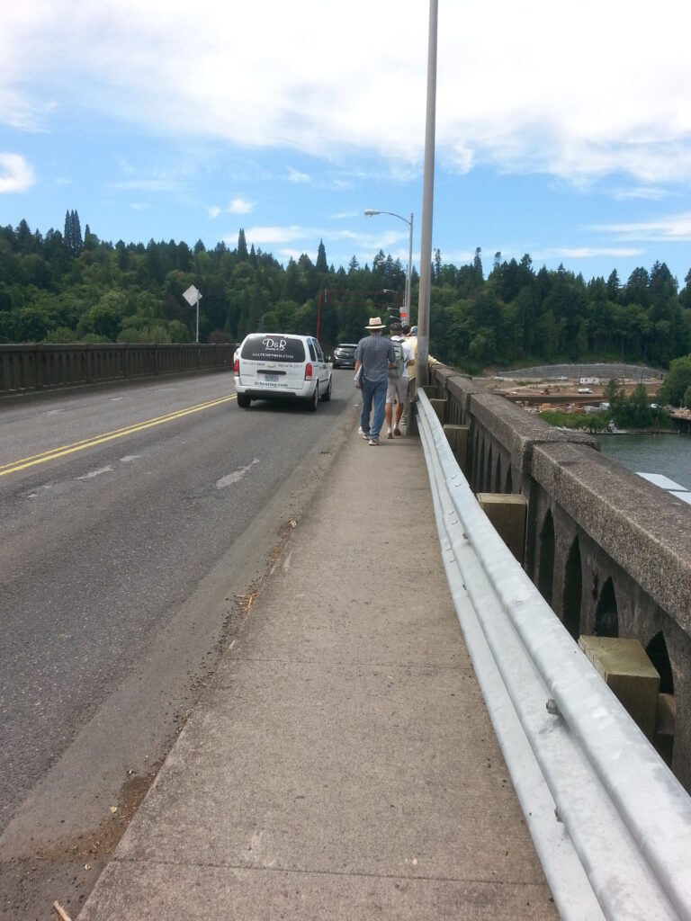 Here’s a reminder of one of the many reasons the Sellwood Bridge needed redoing.  The clearance between the traffic lanes and the light posts is only 23”, a dangerous choke point for pedestrians and bicycles trying to pass in opposite directions.