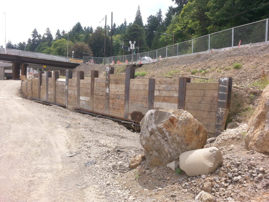 This type of wood-and-steel wall, where 12x12 wooden beams are captured between vertical steel I-beams, is common throughout the project.  Interestingly, the first beam goes in at the top and the other beams are added from below.  Don’t ask how.