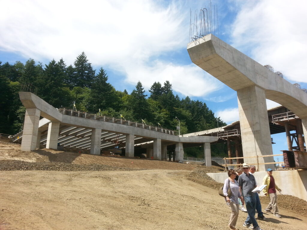 The new interchange on the west side of the river is a major part of the Sellwood Bridge project.  This picture shows the west approach span to the bridge in the foreground, with the interchange itself in the background.